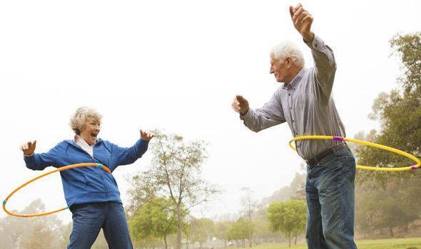 old couple enjoying hula hoop