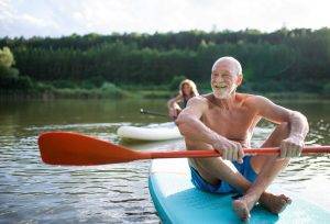 older couple on a lake
enjoying long life