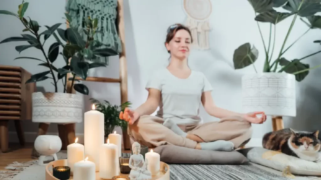 woman meditating with cat beside her - c60 mental focus